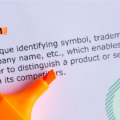 Black text on lilac paper. the header reads: brand. Orange highlighter placed on paper.