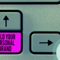 Picture of a keyboard with a purple key. Text on the key reads 'build your personal brand'